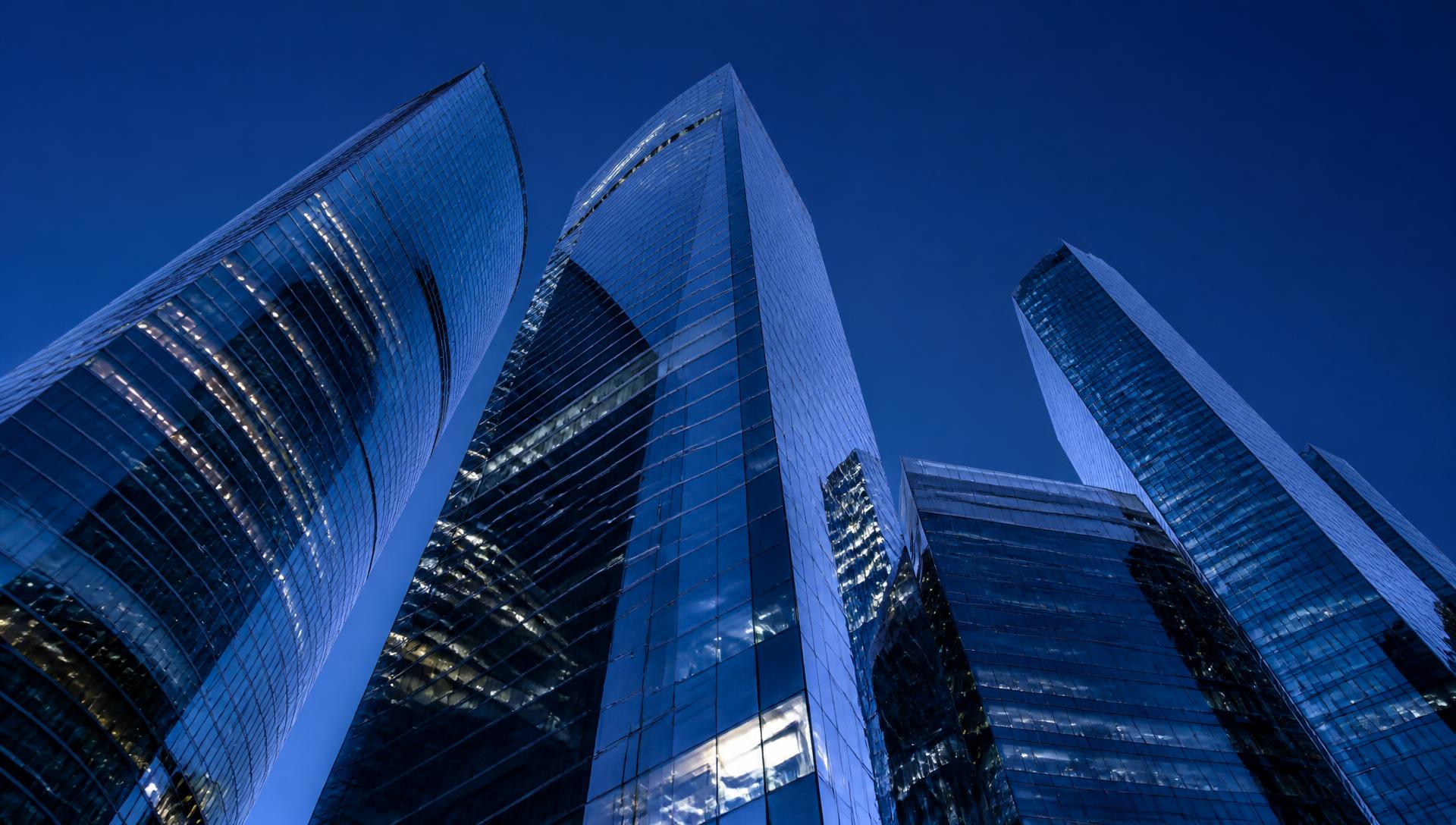 Modern glass towers at blue hour